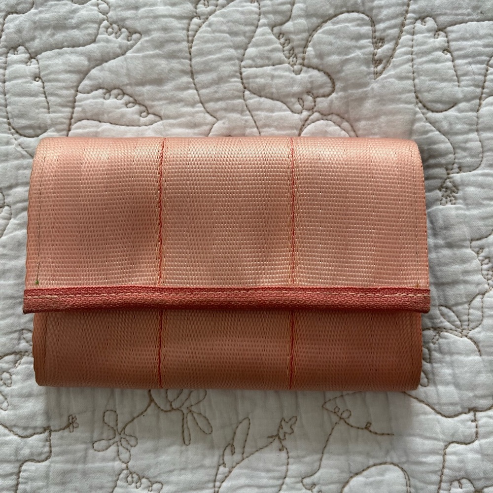 Peach Harvey’s seatbelt bag snap wallet with tropical liner